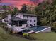 Beautiful backyard featuring a pool, patio and lush landscaping against a backdrop of mature trees at 2672 Langland Ne Ct, Atlanta, GA 30345