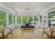 Bright sunroom with hardwood floors and views of the backyard pool at 2672 Langland Ne Ct, Atlanta, GA 30345