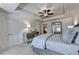 Serene bedroom with tray ceilings, neutral decor, and mirrored dresser at 2698 Ne Almand Ln, Conyers, GA 30013