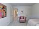 Inviting bedroom showcasing a plush chair and a stylish accent wall, creating a relaxing and comfortable space at 2698 Ne Almand Ln, Conyers, GA 30013