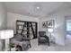 Cozy sitting area with comfortable chairs and stylish bookshelves, perfect for reading and relaxation at 2698 Ne Almand Ln, Conyers, GA 30013