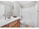 Bathroom with a single sink vanity and combined tub and shower at 3660 Lake Pass Ln, Suwanee, GA 30024