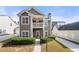 Charming two-story home with welcoming porch, landscaped yard, and private driveway at 3660 Lake Pass Ln, Suwanee, GA 30024