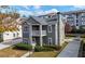 Charming two-story home with welcoming porch, landscaped yard, and private driveway at 3660 Lake Pass Ln, Suwanee, GA 30024