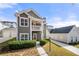 A delightful property featuring a welcoming porch, landscaped yard, and private driveway, perfect for families at 3660 Lake Pass Ln, Suwanee, GA 30024