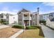 Charming two-story home with a cozy front porch and well-maintained landscaping at 3660 Lake Pass Ln, Suwanee, GA 30024
