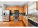 Functional kitchen features stainless steel appliances, granite countertops, and ample cabinet space at 3660 Lake Pass Ln, Suwanee, GA 30024