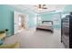 Bright primary bedroom showcases en-suite bathroom, bed, and fresh blue paint at 3660 Lake Pass Ln, Suwanee, GA 30024