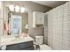 Bathroom with a large single vanity, cabinet, and shower-tub combo with patterned curtain at 3736 Chattahoochee Summit Se Dr # 20, Atlanta, GA 30339