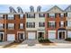 A row of brick and siding townhomes with individual garages and private entrances at 3736 Chattahoochee Summit Se Dr # 20, Atlanta, GA 30339