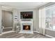 Close up of the modern fireplace with tile surround and decorative mantel in the living room at 3736 Chattahoochee Summit Se Dr # 20, Atlanta, GA 30339