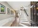 Inviting foyer with wood floors, stairs, and wall art, leading to other areas of the home at 3736 Chattahoochee Summit Se Dr # 20, Atlanta, GA 30339