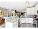 Modern kitchen with white cabinets, granite countertops, stainless steel appliances, and an open layout at 3736 Chattahoochee Summit Se Dr # 20, Atlanta, GA 30339