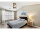 Comfortable main bedroom with a bed, nightstands, lamps, and natural light from a window at 3736 Chattahoochee Summit Se Dr # 20, Atlanta, GA 30339
