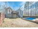 Backyard of a home with an in-ground pool, deck, and a privacy fence at 186 Brandi Dr, Hiram, GA 30141