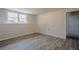 Finished basement area featuring wood-look floors and natural light from windows at 186 Brandi Dr, Hiram, GA 30141