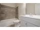 Full bathroom with modern tiled walls, a shower-tub combo, and vanity with storage at 186 Brandi Dr, Hiram, GA 30141