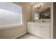 Bathroom featuring double sink vanity with a large window and privacy screen at 186 Brandi Dr, Hiram, GA 30141