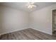 Bedroom with wood-look flooring, ceiling fan, and neutral colored walls at 186 Brandi Dr, Hiram, GA 30141