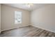 Comfortable bedroom with ceiling fan, wood-look flooring, and a sunny window at 186 Brandi Dr, Hiram, GA 30141