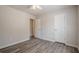 Bedroom with wood-look flooring, ceiling fan, and neutral colored walls at 186 Brandi Dr, Hiram, GA 30141