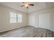 Bedroom featuring wood floors, a ceiling fan, blinds, and a closet at 186 Brandi Dr, Hiram, GA 30141
