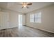 Bright bedroom with wood-look flooring, large window, and neutral paint at 186 Brandi Dr, Hiram, GA 30141