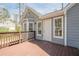 A view of a gray home exterior from a wood deck with railings at 186 Brandi Dr, Hiram, GA 30141