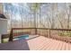 Wood deck overlooking a backyard with a pool and mature trees at 186 Brandi Dr, Hiram, GA 30141