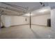A spacious two car garage with concrete flooring and a service door at 186 Brandi Dr, Hiram, GA 30141