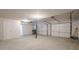 View of a two car garage with white walls, concrete flooring and white doors at 186 Brandi Dr, Hiram, GA 30141