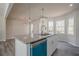 Kitchen island featuring granite countertops and sink, view of light filled breakfast nook at 186 Brandi Dr, Hiram, GA 30141