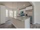 Bright and airy kitchen with white cabinets, granite counters, stainless steel appliances, and island with a sink at 186 Brandi Dr, Hiram, GA 30141