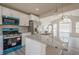 Modern kitchen with white cabinets, granite countertops, stainless steel appliances, island and view to living room at 186 Brandi Dr, Hiram, GA 30141