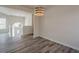 Living room featuring stylish floors and modern light fixture; inviting entrance welcomes guests with natural light at 186 Brandi Dr, Hiram, GA 30141