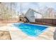 View of a fenced in-ground swimming pool with concrete surround at 186 Brandi Dr, Hiram, GA 30141