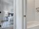 Inviting bedroom view through bathroom doorway with tiled shower and tub at 2171 James Aly, Atlanta, GA 30345