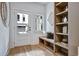 Welcoming entryway with a built-in bench, book case, and large front door at 2171 James Aly, Atlanta, GA 30345