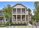 Two-story home featuring a brick foundation, covered porches, and manicured landscaping at 2171 James Aly, Atlanta, GA 30345