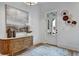 Entryway features a stylish sideboard, decorative art, and a view of the front door at 2171 James Aly, Atlanta, GA 30345