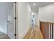Well-lit hallway featuring hardwood floors, white walls, and elegant trim at 2171 James Aly, Atlanta, GA 30345