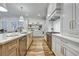 Spacious kitchen with stainless appliances, custom cabinetry, and open shelving at 2171 James Aly, Atlanta, GA 30345