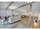 Open floor plan featuring hardwood floors, a fireplace, a modern kitchen, and an island with barstool seating at 2171 James Aly, Atlanta, GA 30345