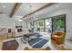 Bright living room featuring hardwood floors, exposed beams and large sliding glass doors to the deck at 2171 James Aly, Atlanta, GA 30345
