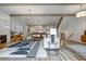 Spacious living room with fireplace, hardwood floors, and open access to kitchen and dining area at 2171 James Aly, Atlanta, GA 30345