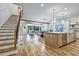 Open-concept living space with hardwood floors and staircase leading to the upper level at 2171 James Aly, Atlanta, GA 30345