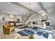 Open concept living space with hardwood floors, contemporary lighting and staircase access at 2171 James Aly, Atlanta, GA 30345