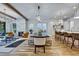 Open floor plan features living area, dining area, and kitchen with white cabinets and bar seating at 2171 James Aly, Atlanta, GA 30345