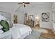 Bright main bedroom featuring tray ceiling, white walls, and a decorative rug on hardwood flooring at 2171 James Aly, Atlanta, GA 30345