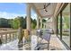 Relaxing outdoor space featuring a dining table, chairs, and a view of the serene landscape at 2171 James Aly, Atlanta, GA 30345